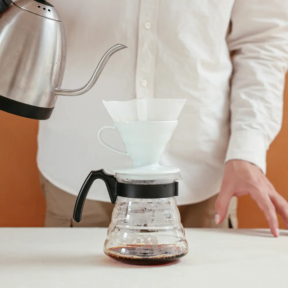 pour over coffee brewing with a gooseneck kettle with a size 4 filter