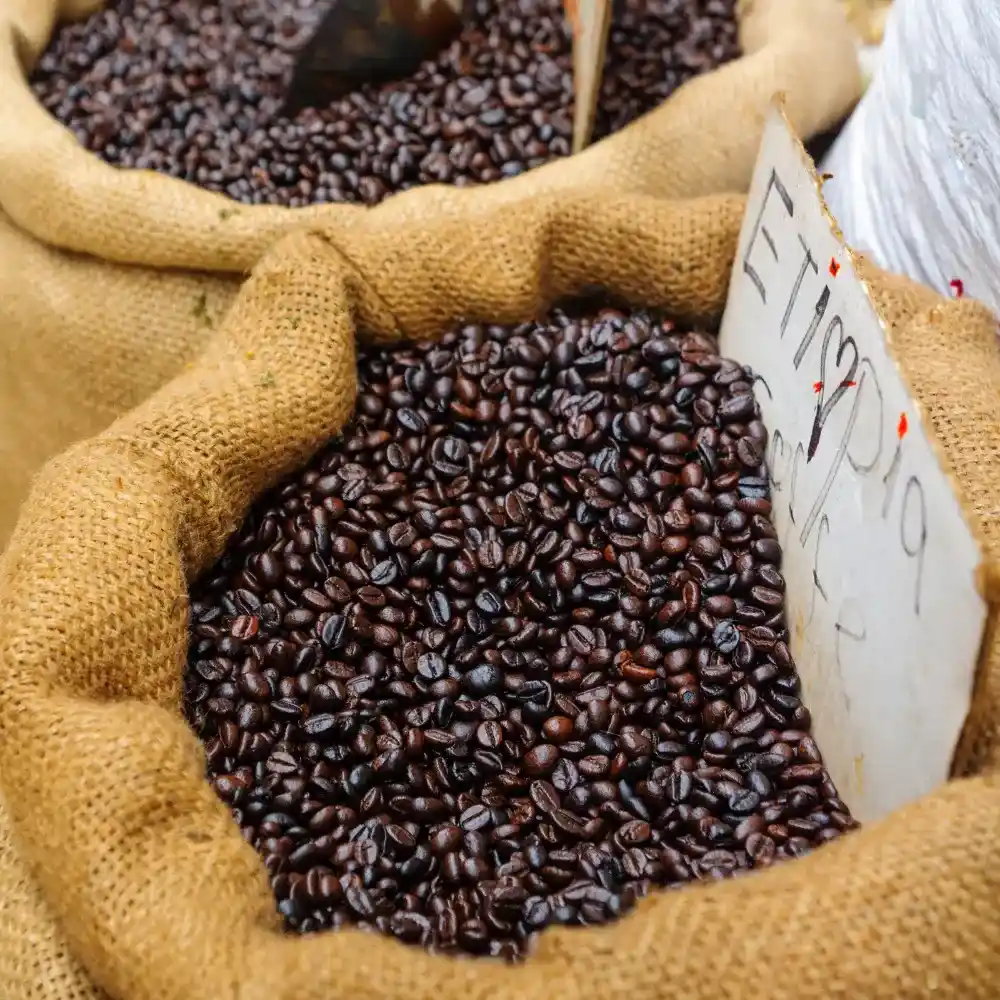dark roast coffee beans in a sac
