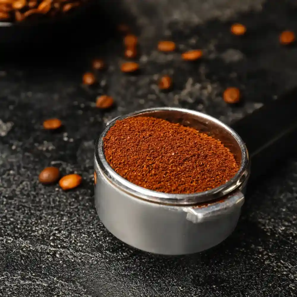 ground coffee in a porta filter