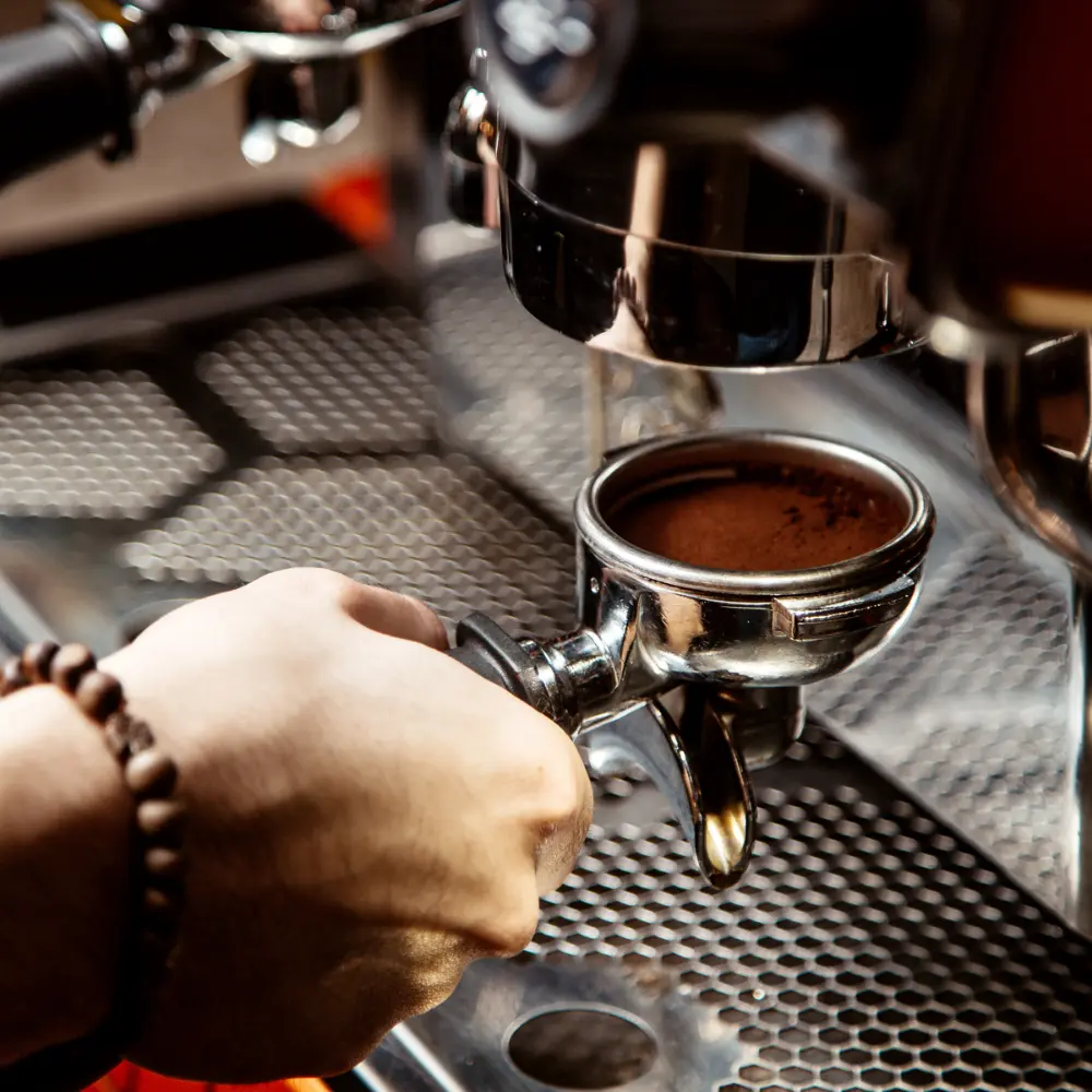 barista making an espresso