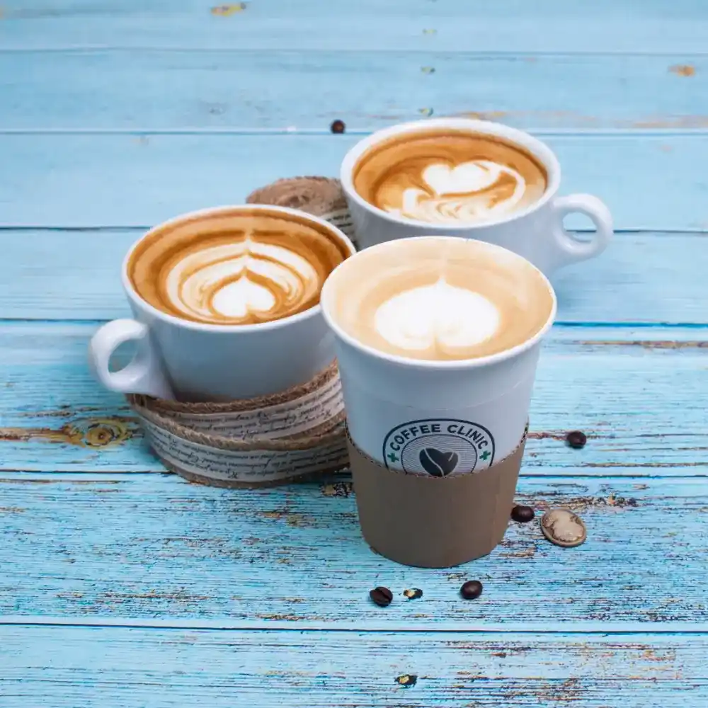 various coffee drinks on a blue wooden table