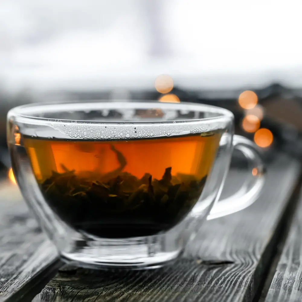 a clear mug of steeped tea