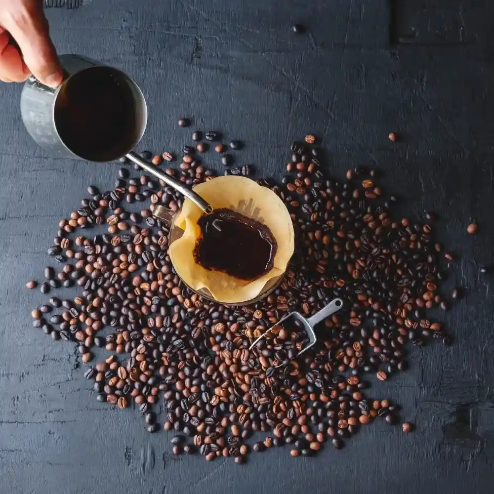 brewing pour over coffee with coffee beans