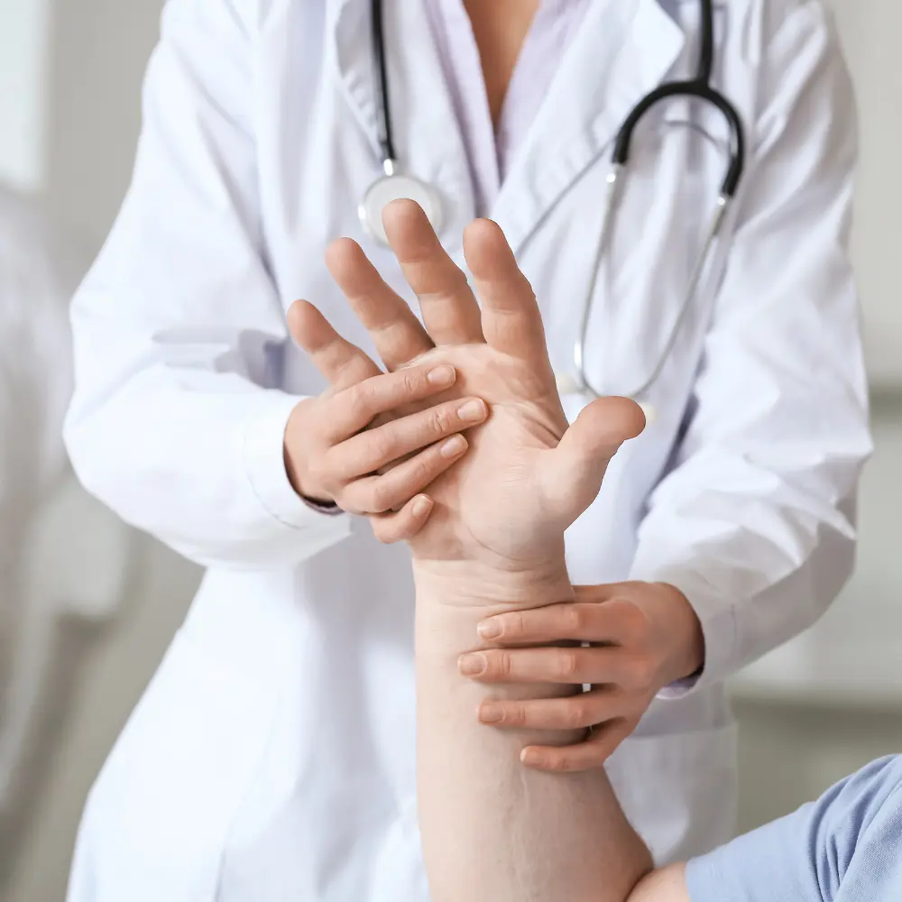 nurse checking a mans hand