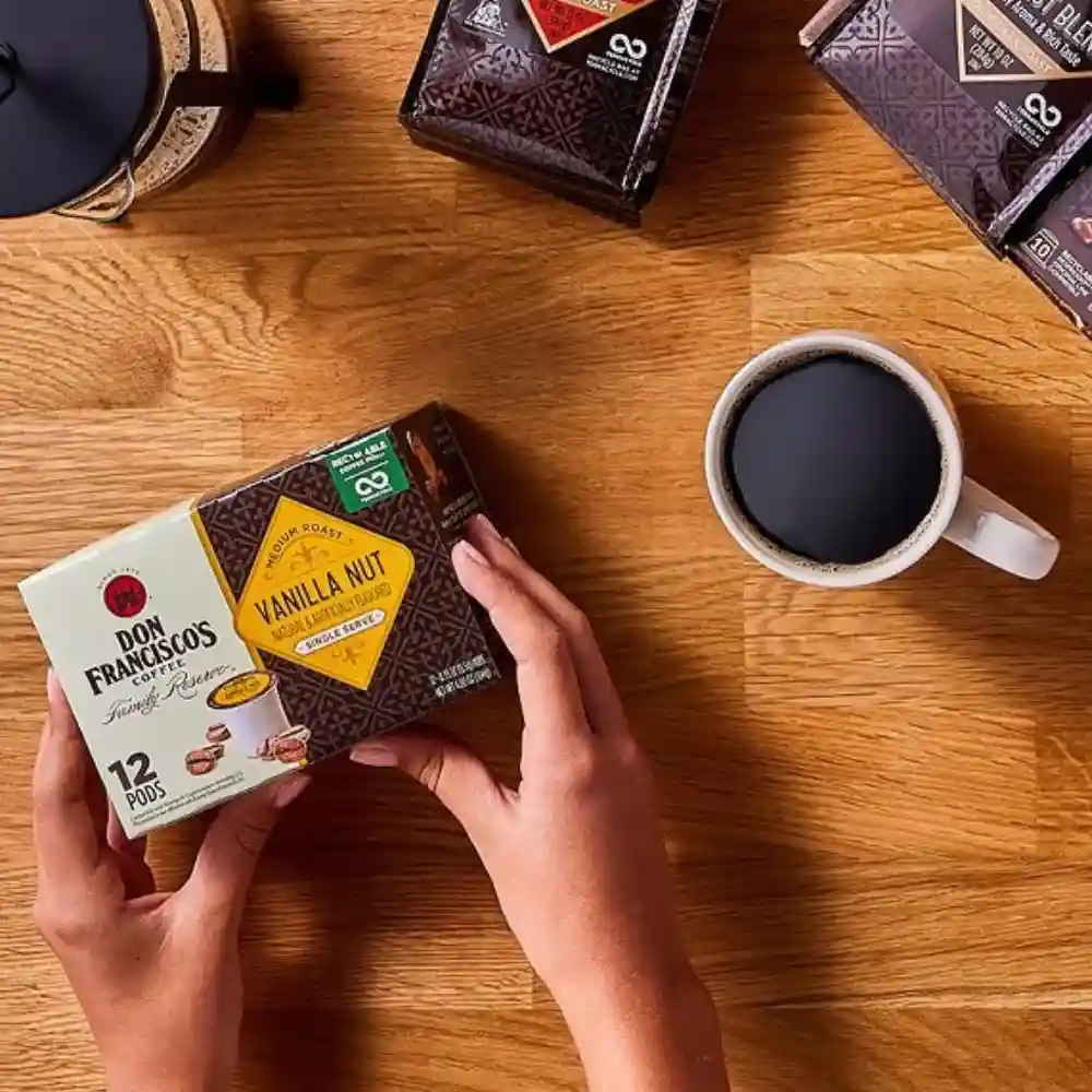 man opening don francisco coffee pods