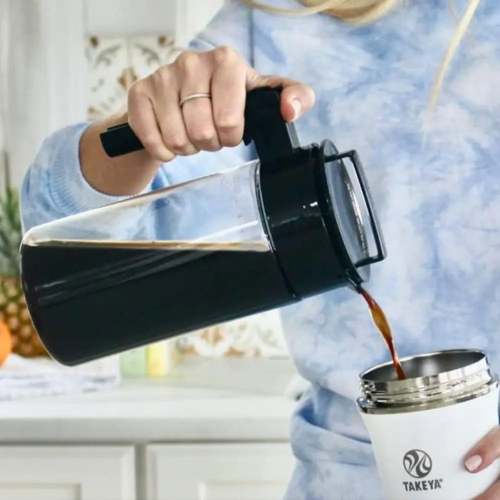 person pouring our cold brew