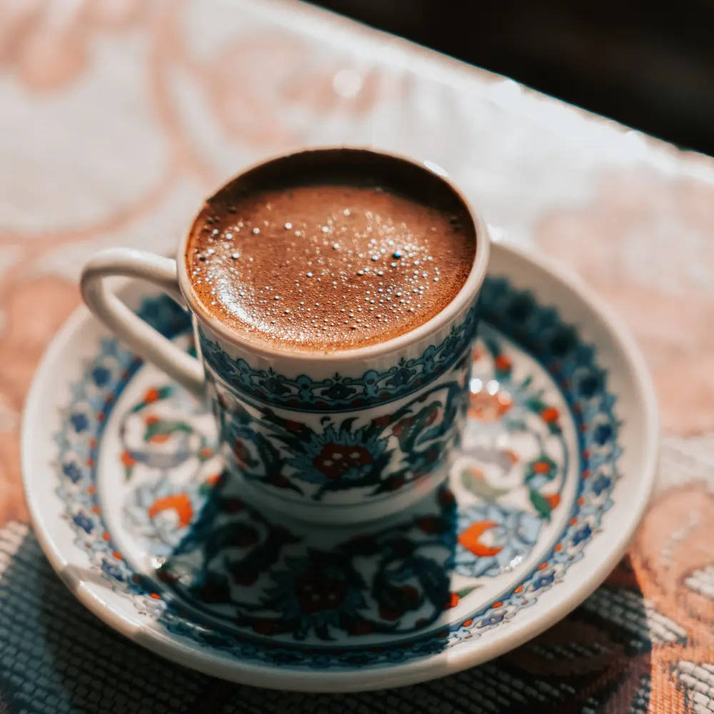 a demitasse cup with coffee