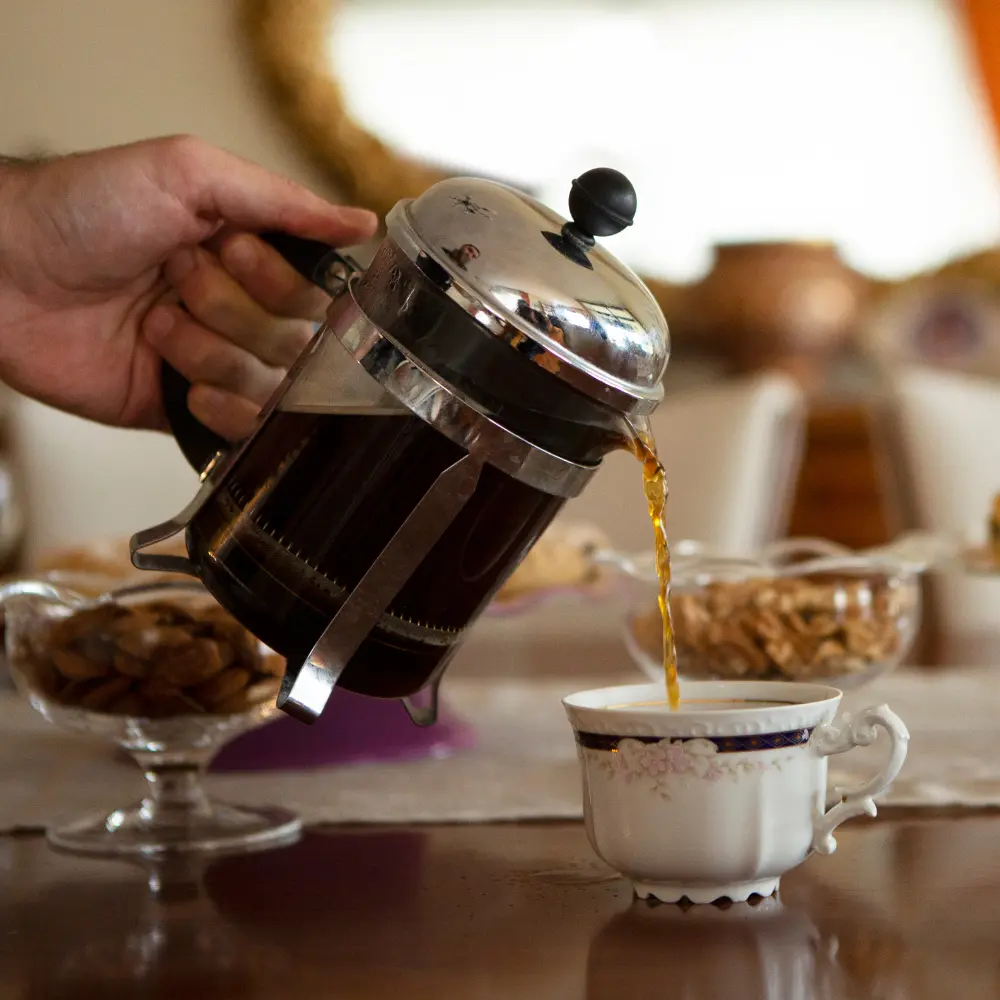 french press pouring coffee