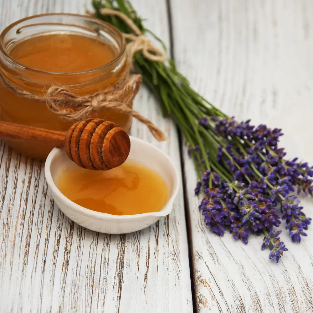 lavender and honey on a white wooden table