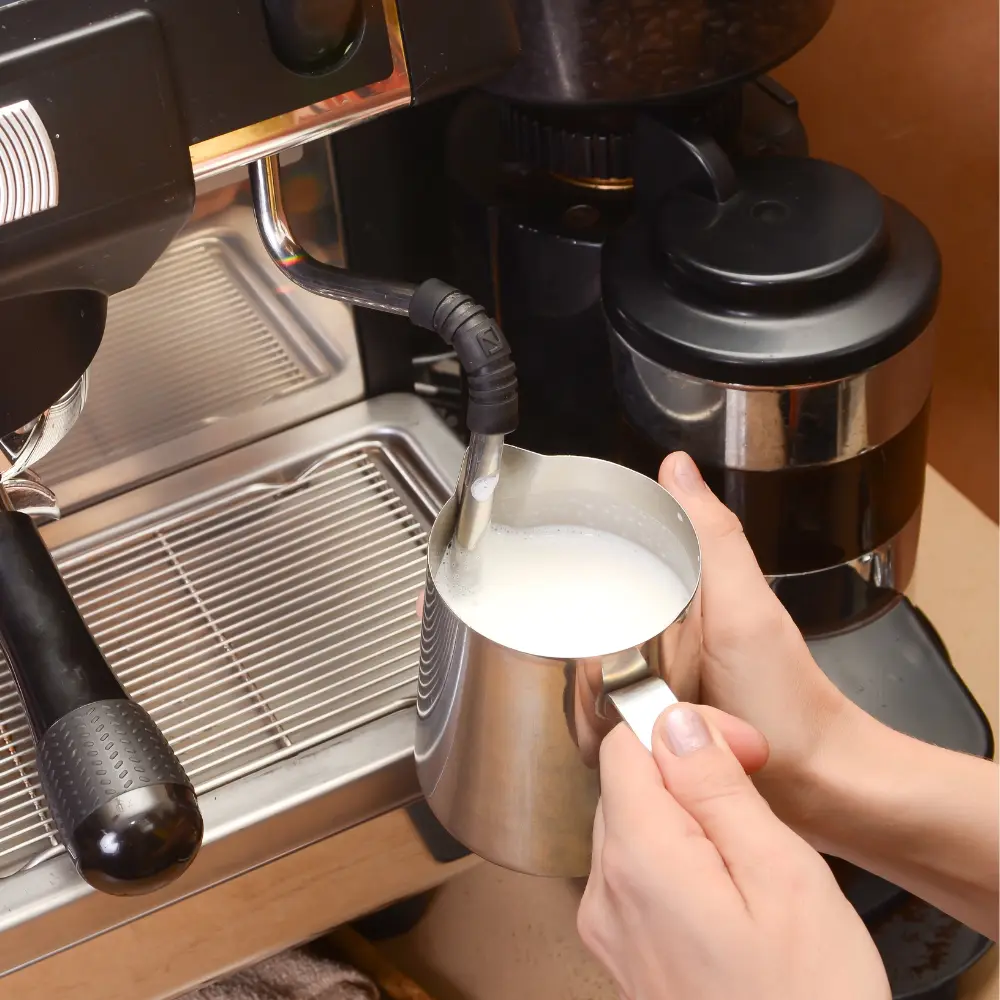 barista frothing milk