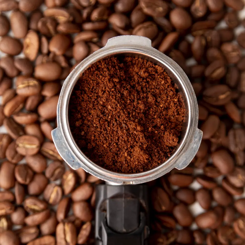 a portafilter filled with ground coffee