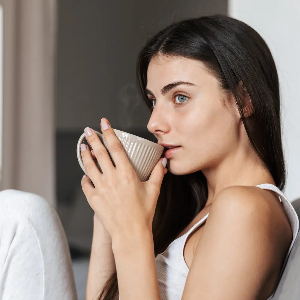 woman sipping on her coffee
