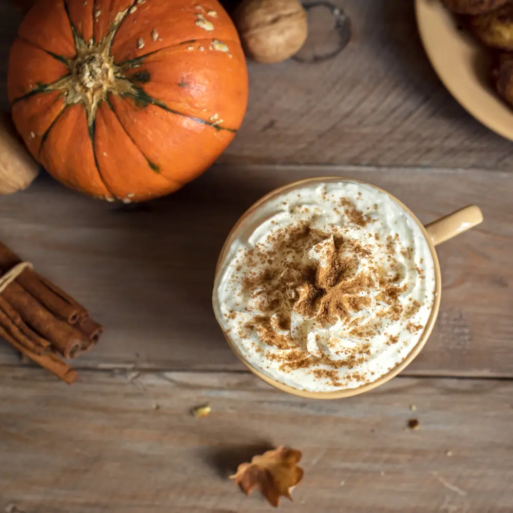 pumpkin spice latte with foam and pumpkin