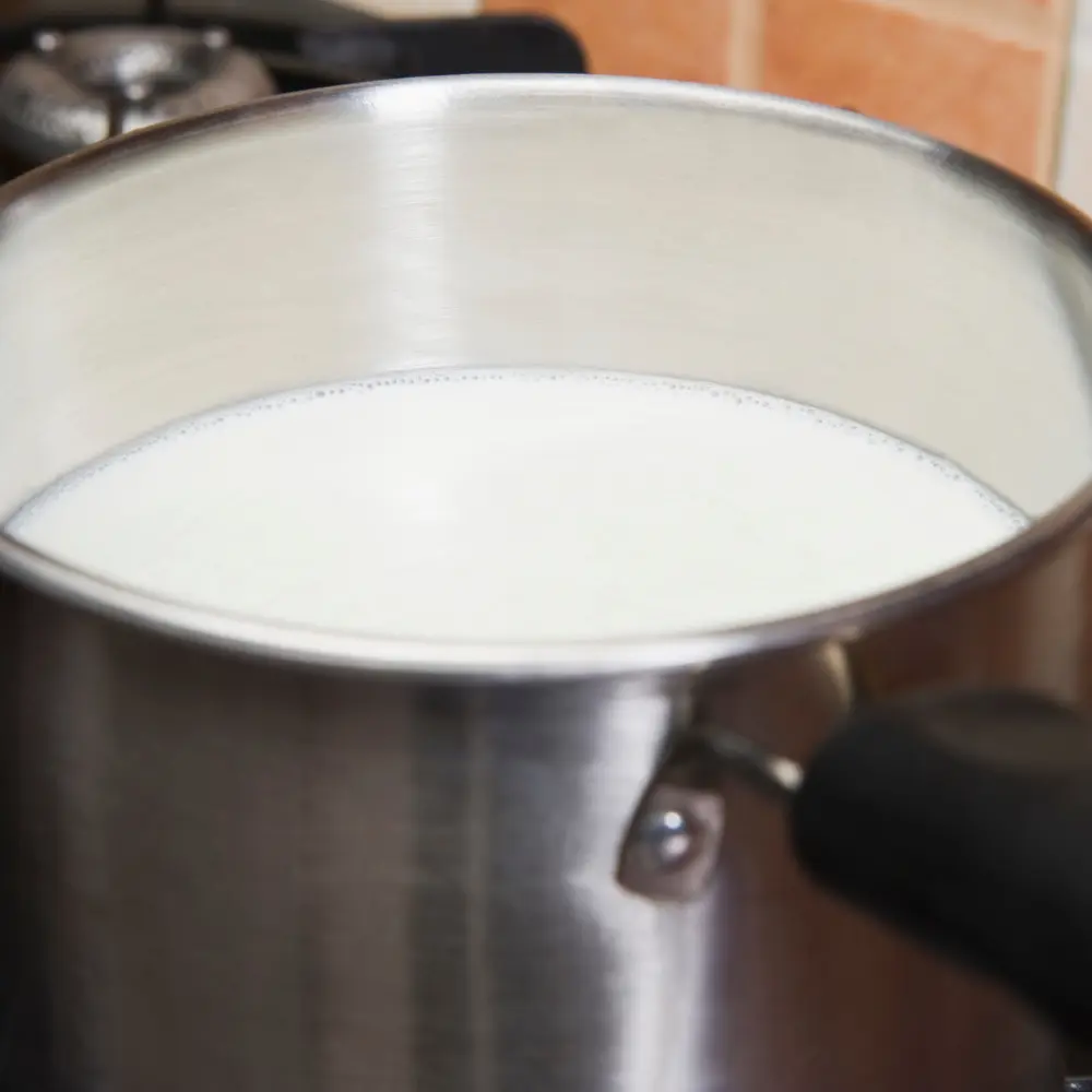 boiling milk in a sauce pant