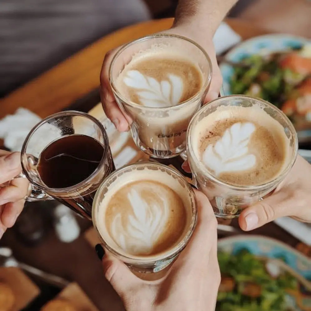 group of people with latte and americano coffee drinks