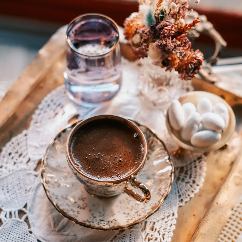 turkish coffee served with water and treats