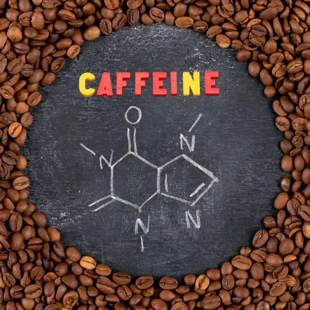 the scientific caffeine symbol and some beans