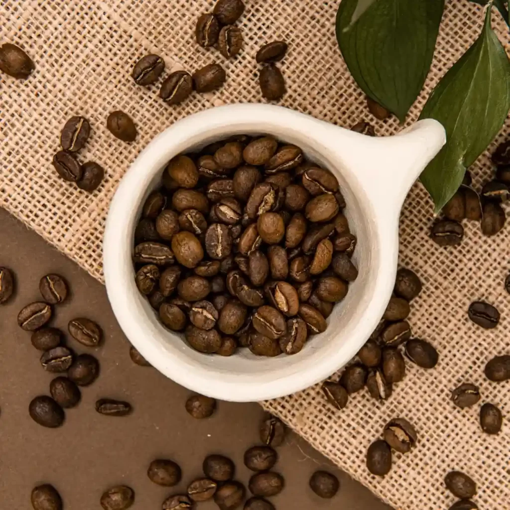 top view of a white mug with vietnamese coffee beans