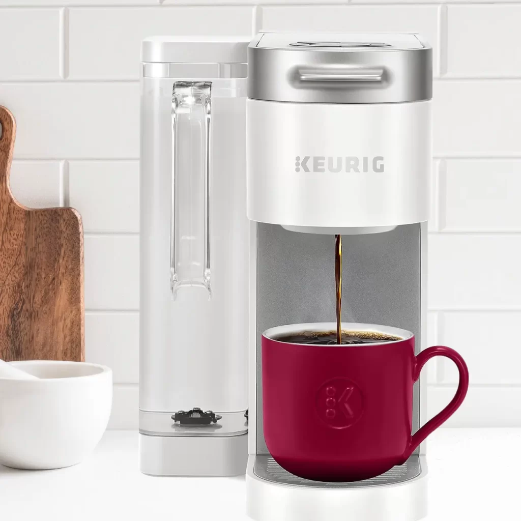 a coffee maker with a cup of coffee