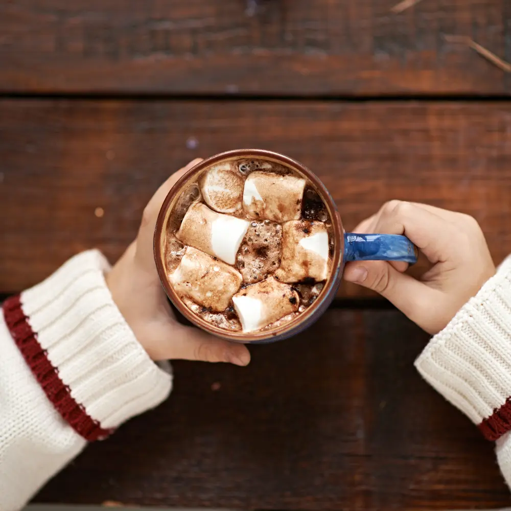 person holding a hot chocolate