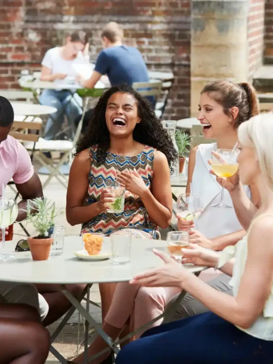 a group of people laughing at a table