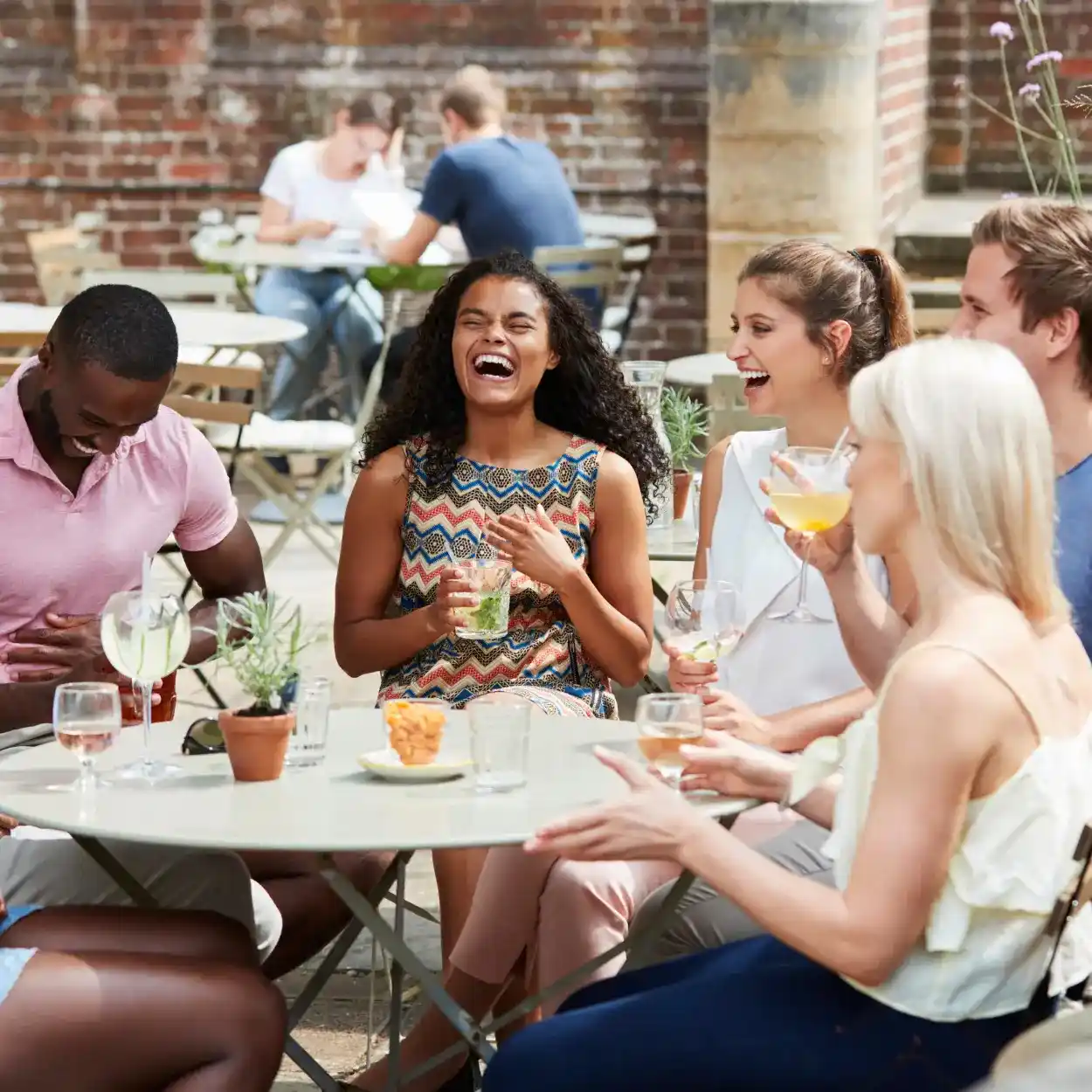 a group of people laughing at a table
