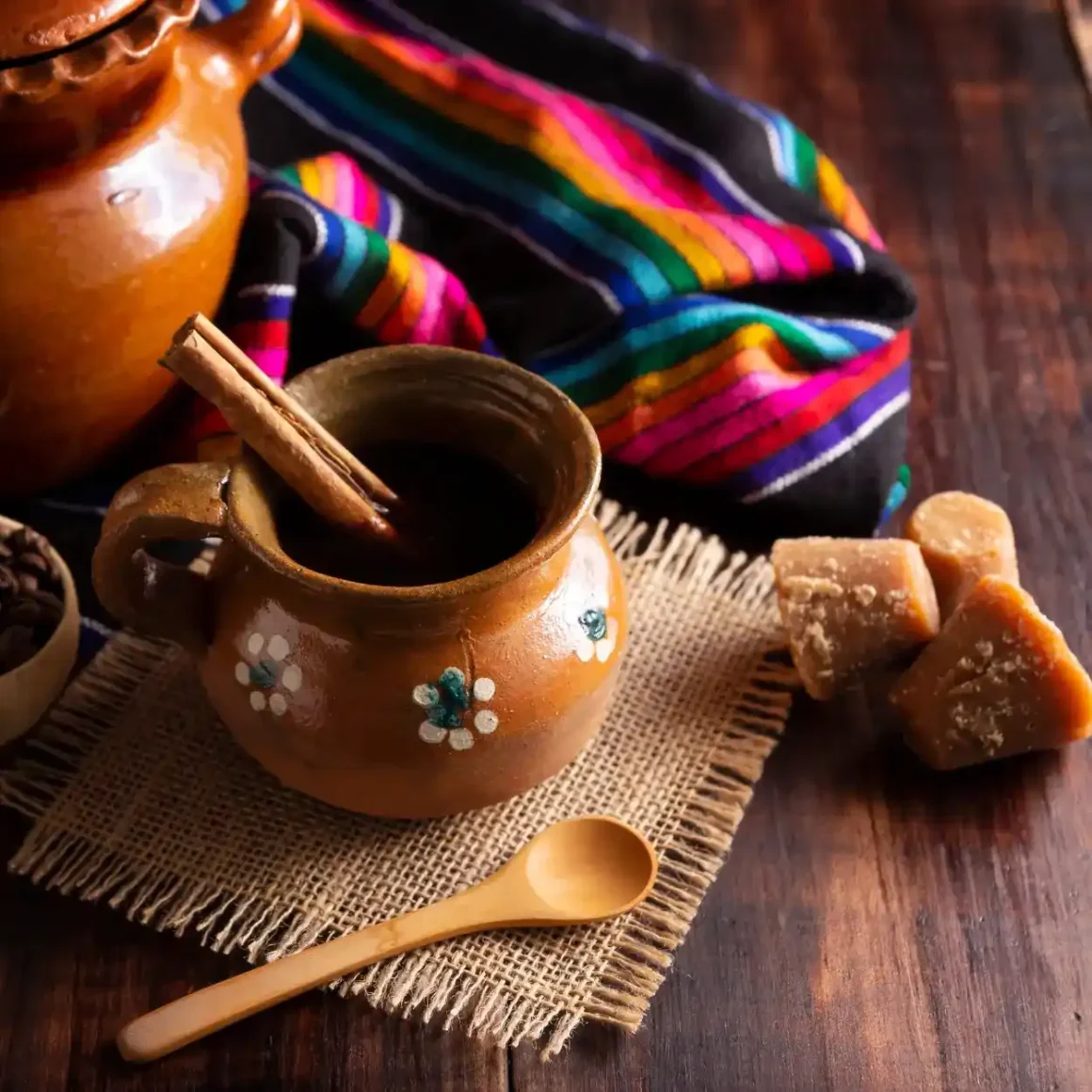 a clay pot with a wooden spoon