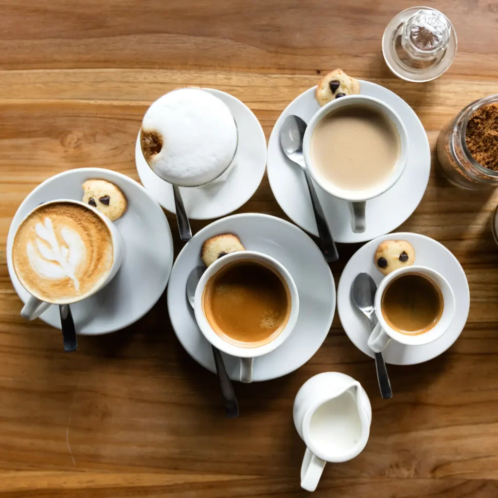 a group of coffee cups on saucers