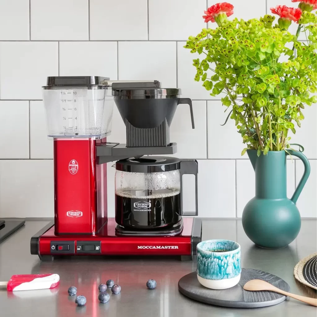a red technivorm moccamaster on a counter