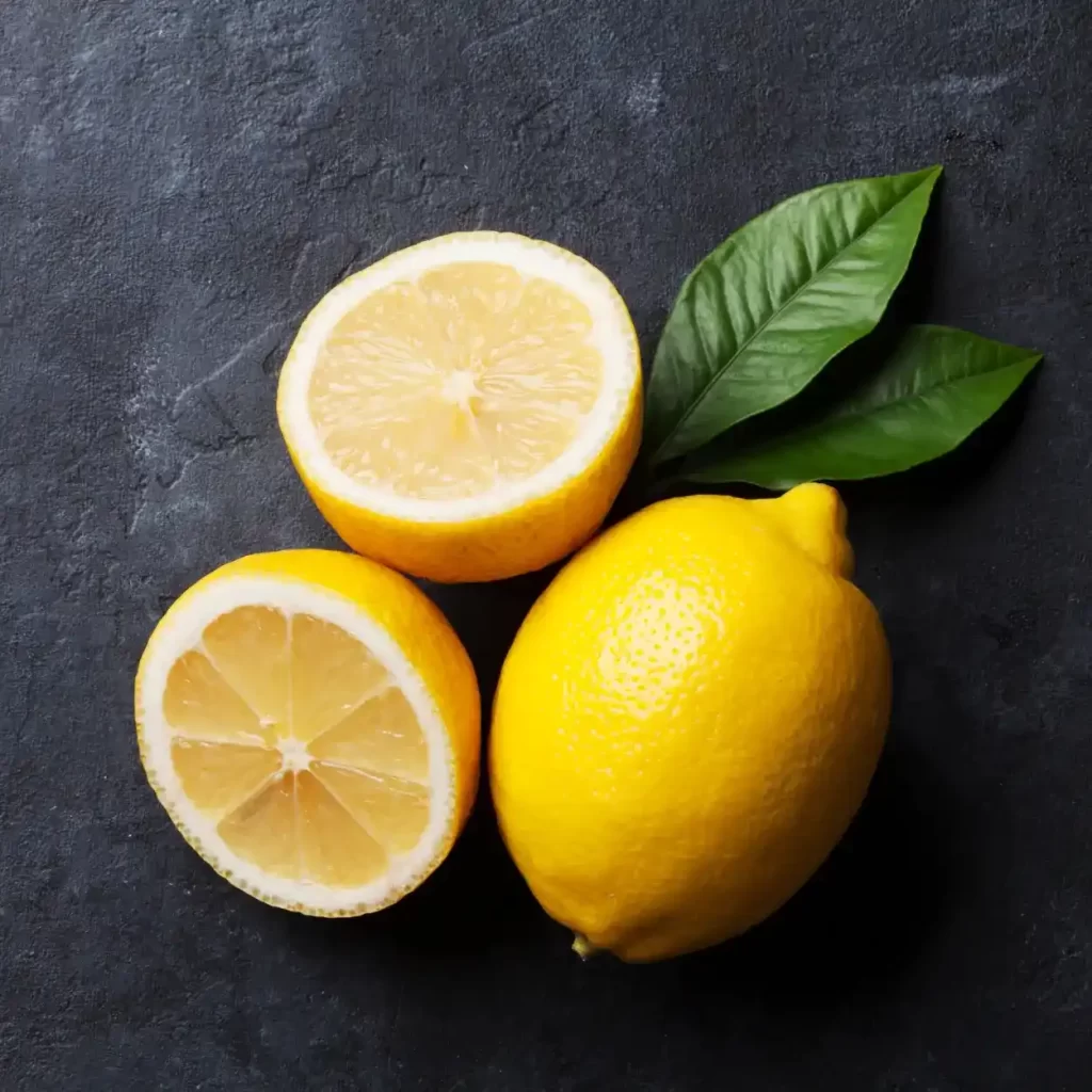 a lemons cut in half and a whole lemon