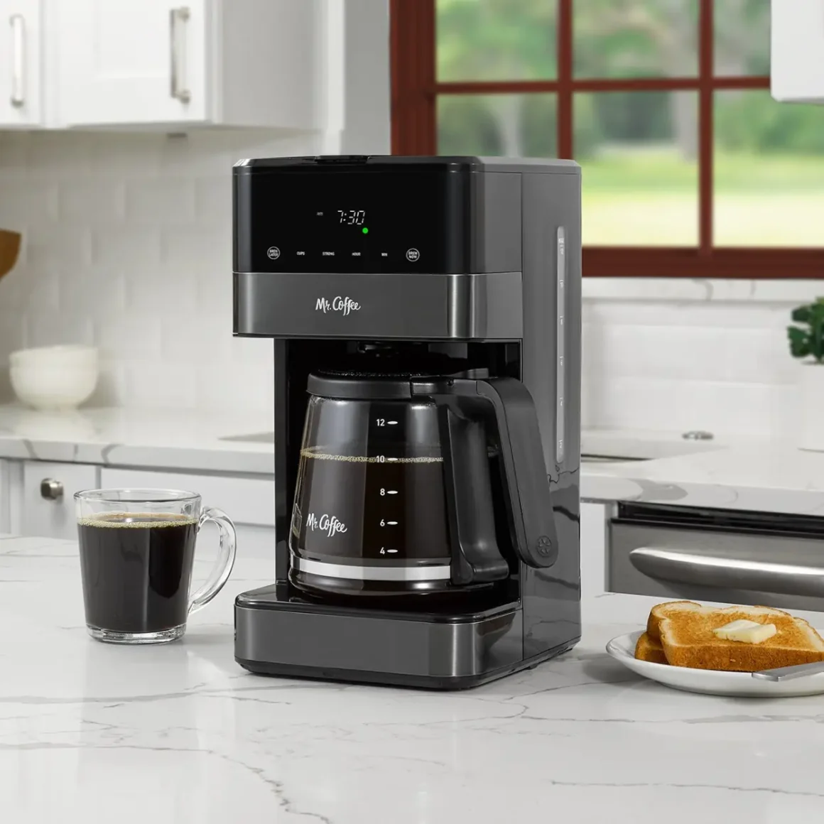 a coffee maker and a plate of toast