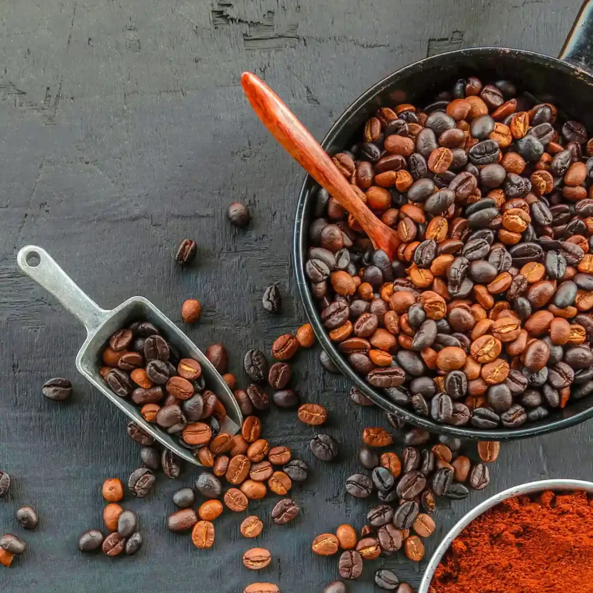 a bowl of blend coffee beans and scoops