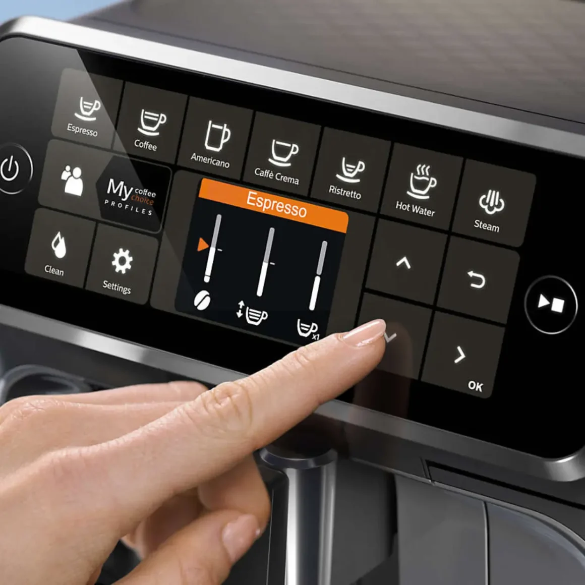 a person using the touch screen of the 4300 espresso machine