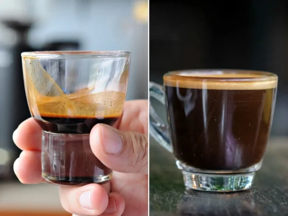 a hand holding a glass of coffee