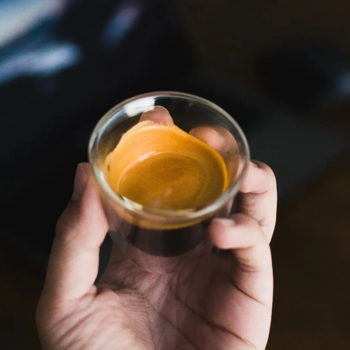 barista analyzing the coffee crema on a ristretto coffee