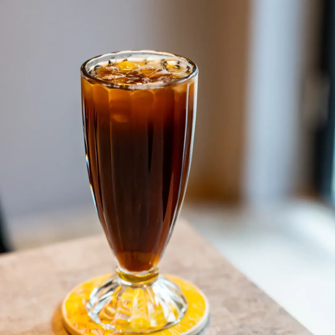 a glass of instant coffee with ice