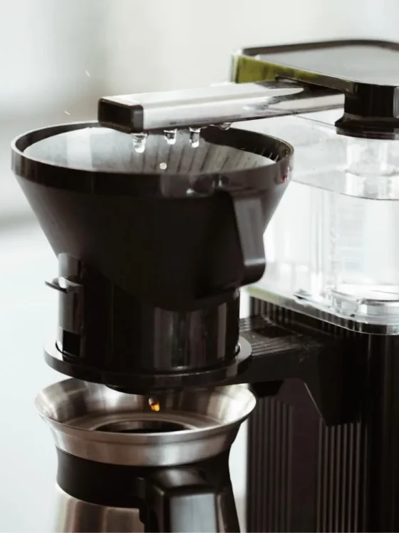 a coffee maker with a filter preparing drip coffee