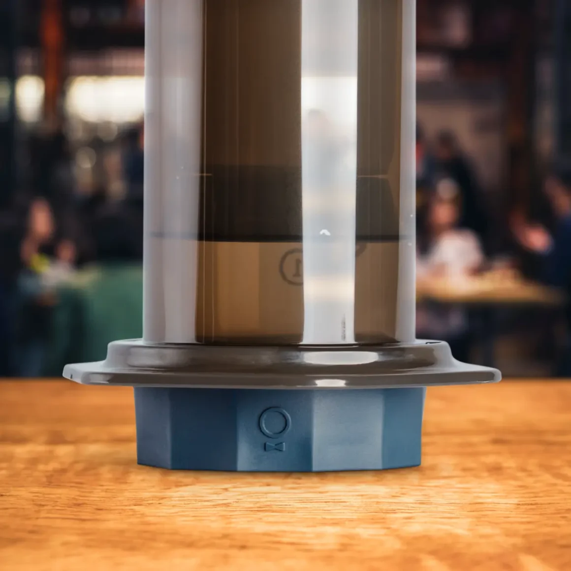 a close up of a coffee maker with a fellow prismo flow control filter cap attached with it