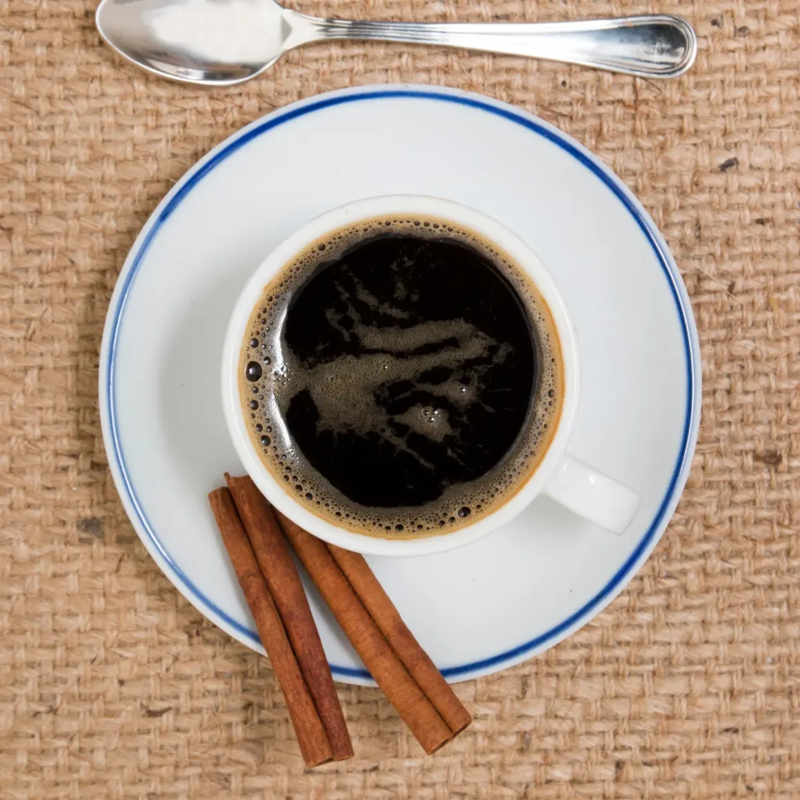 a cup of coffee with a spoon