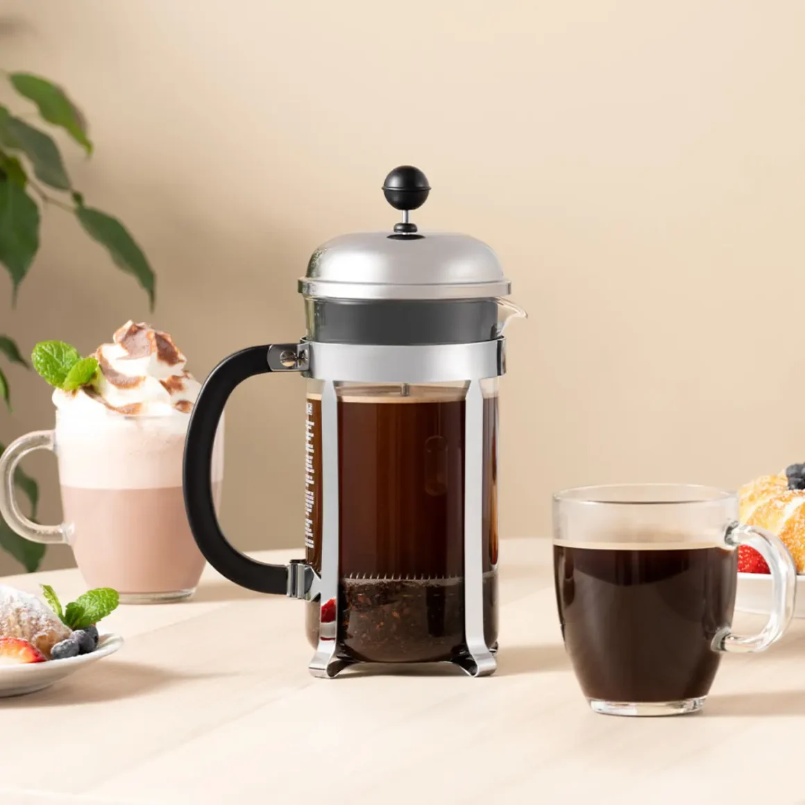 a bodum chambord french press and two cups of coffee