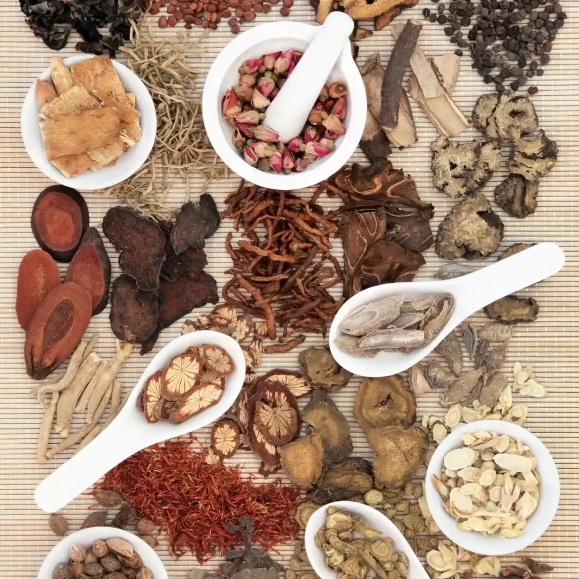 a group of bowls of different herbs and spices