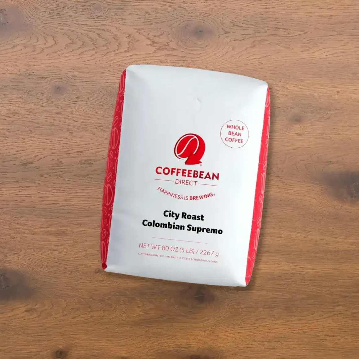 a white and red bag of coffee bean direct city roast colombian supremo coffee
