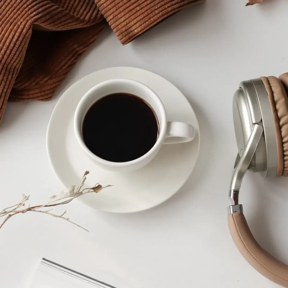 a cup of coffee and headphones