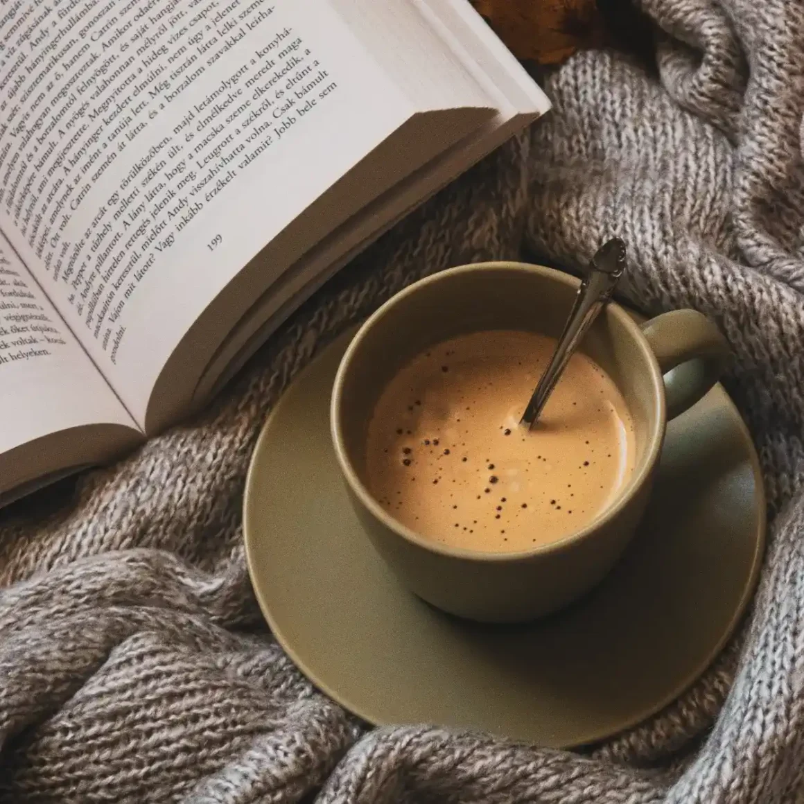 a cup of coffee and a book