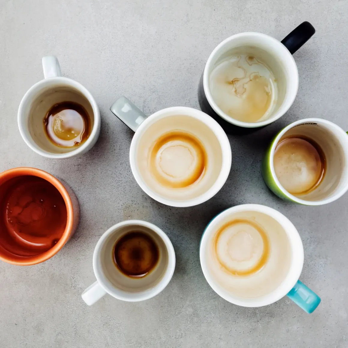 a group of coffee cups with medium and dark roast coffee