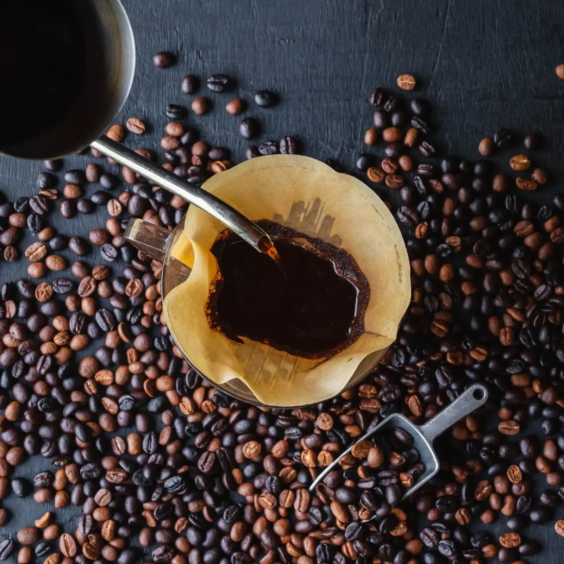 a coffee being poured into a filter