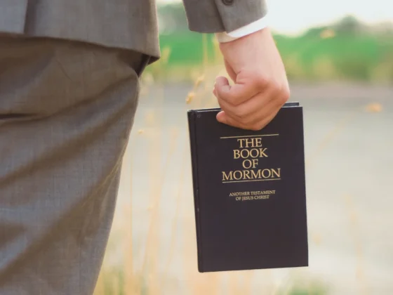 a person holding the book of mormon