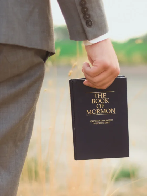 a person holding the book of mormon