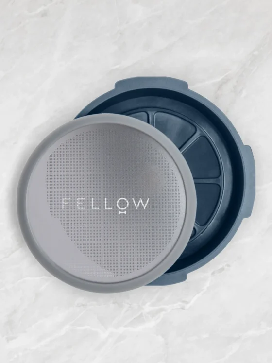 a fellow prismo coffee flow control filter cap on a surface