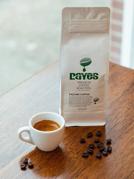 a dayes enzyme fermented whole bean coffee bag next to a cup of espresso